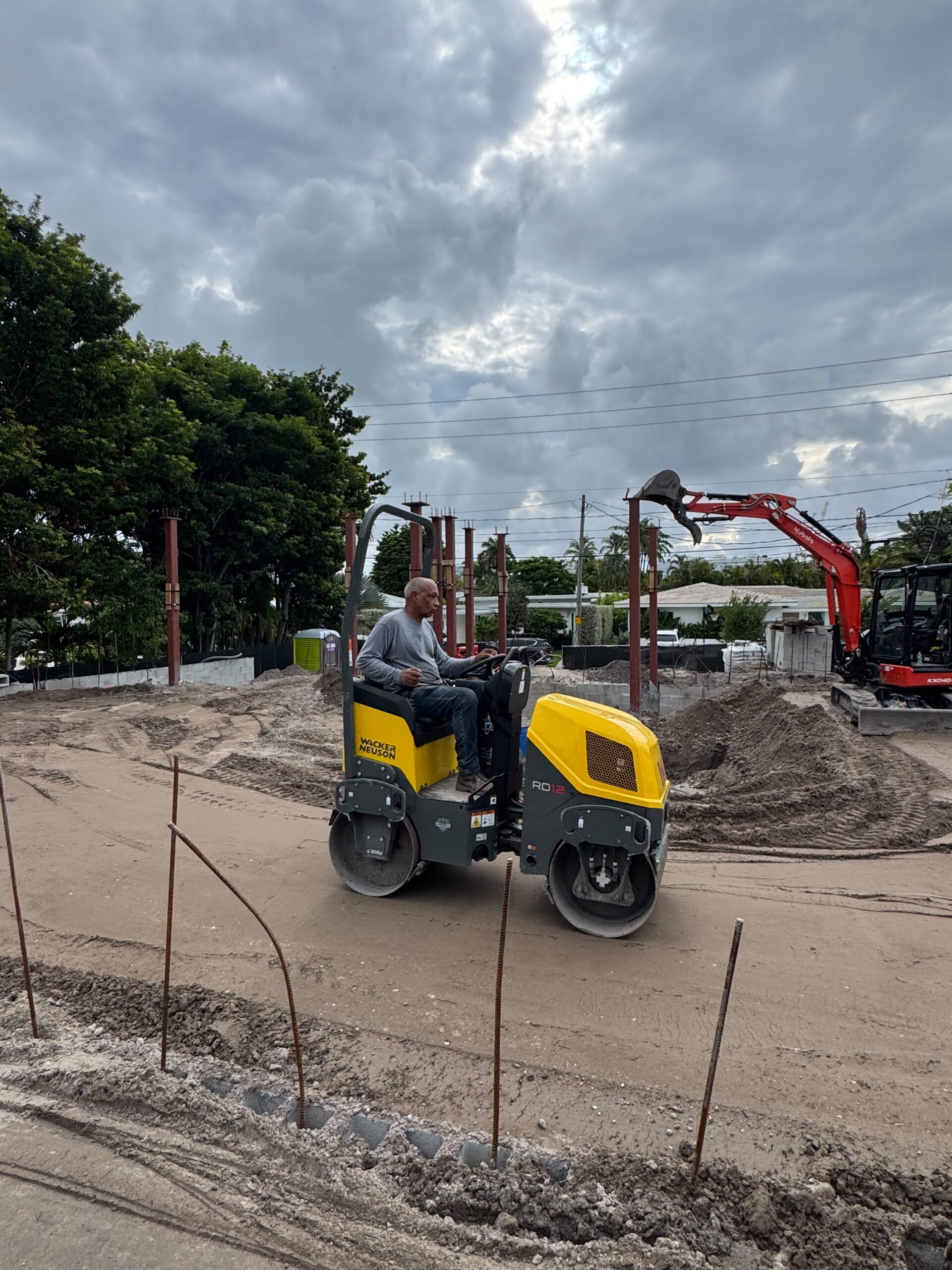 Soil compaction roller on an active construction site