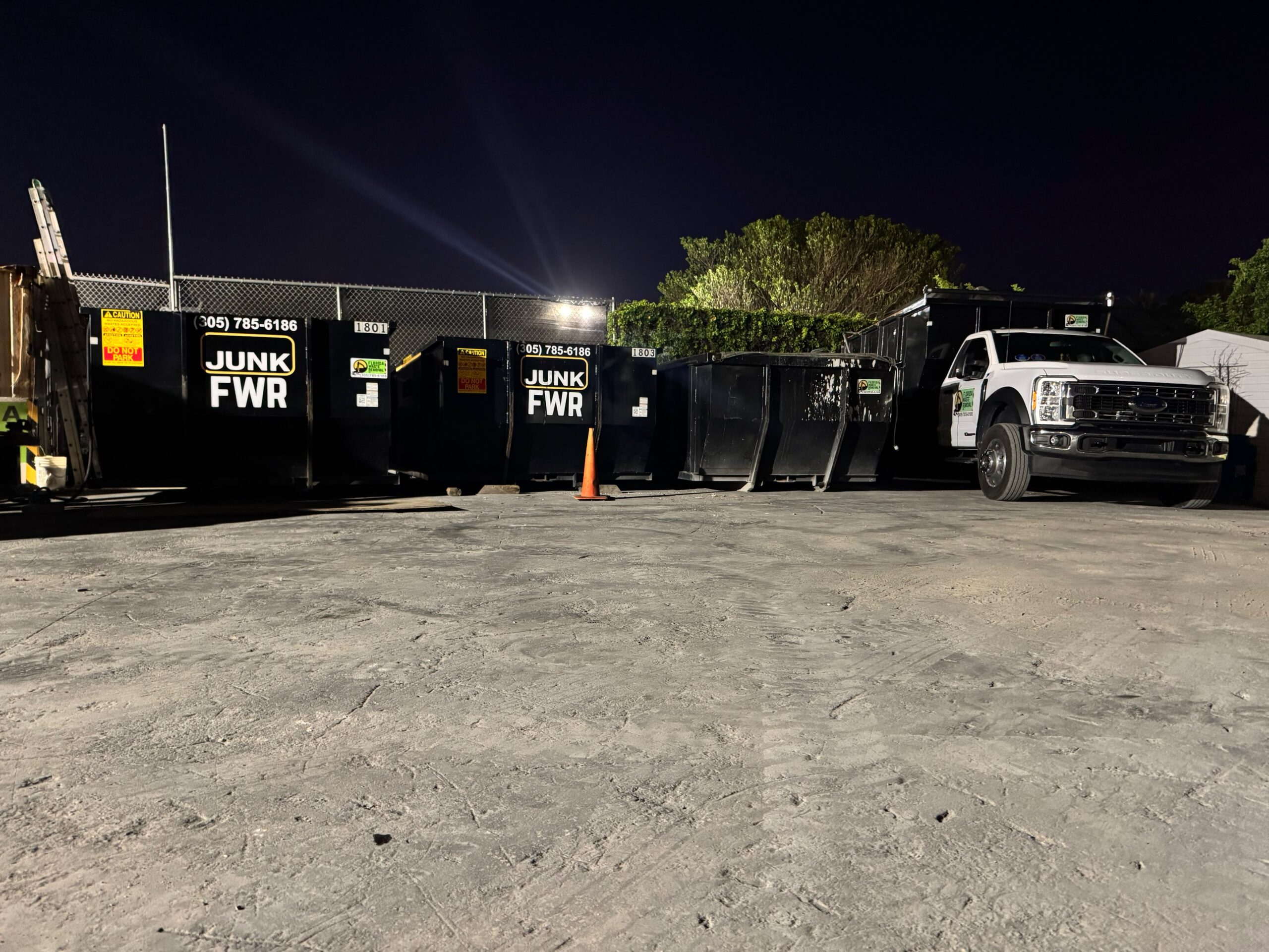 Florida Waste Removal roll-off dumpsters and service truck