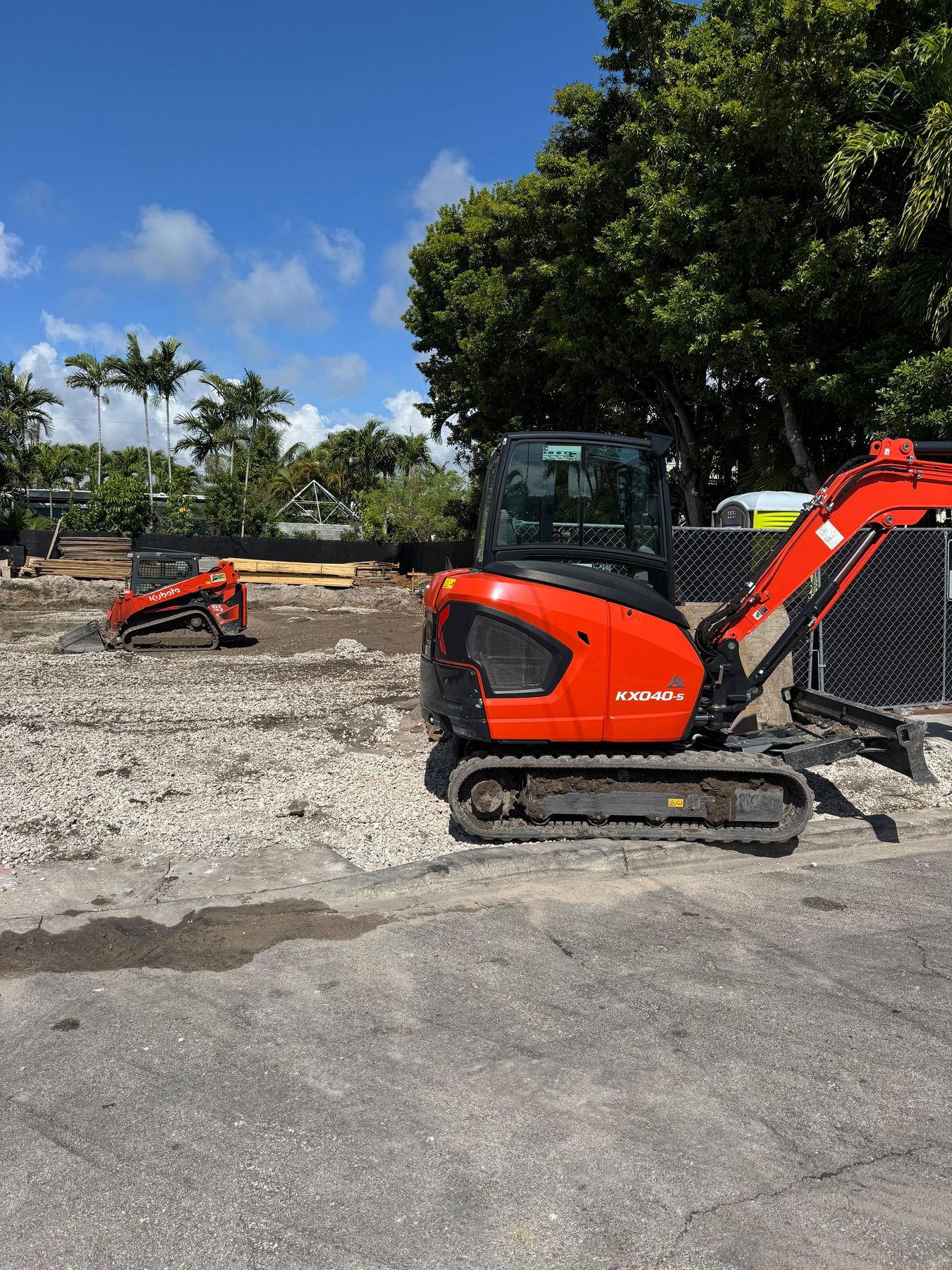 Kubota mini excavator and track loader on a gravel site