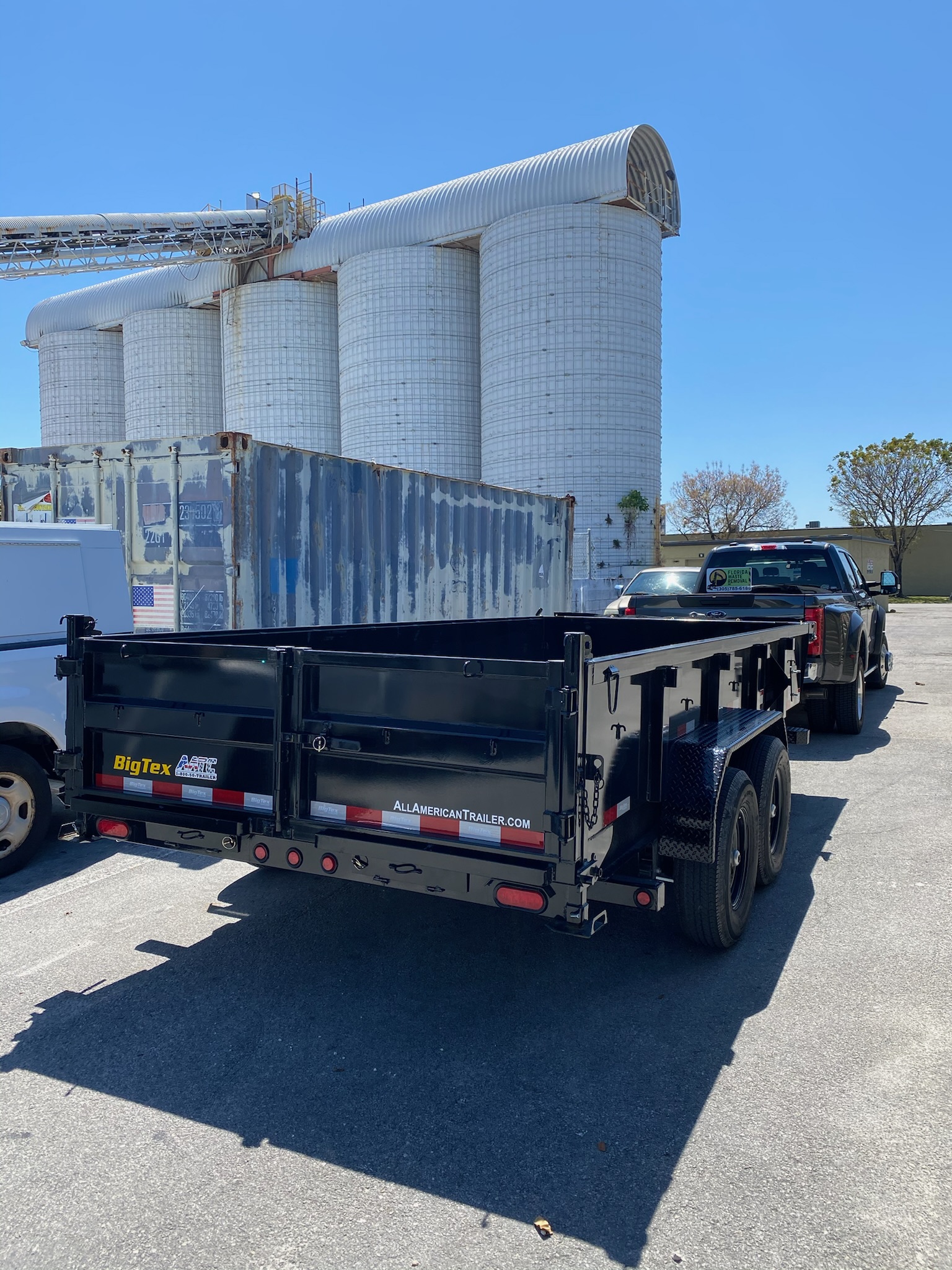 Heavy-duty dump trailer used for dirt and demolition debris hauling in Miami-Dade Broward Palm Beach