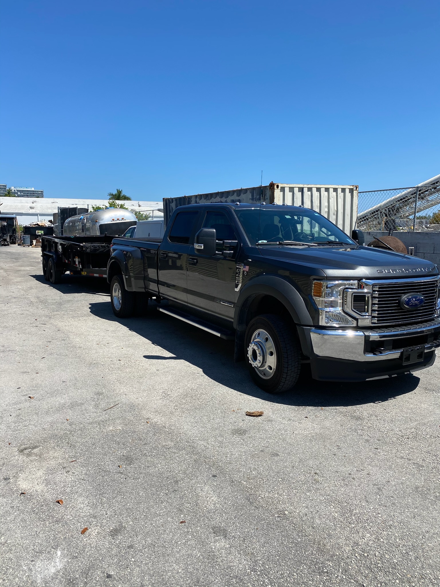 Florida Waste Removal equipment yard with trucks and machines staged for excavation and haul jobs