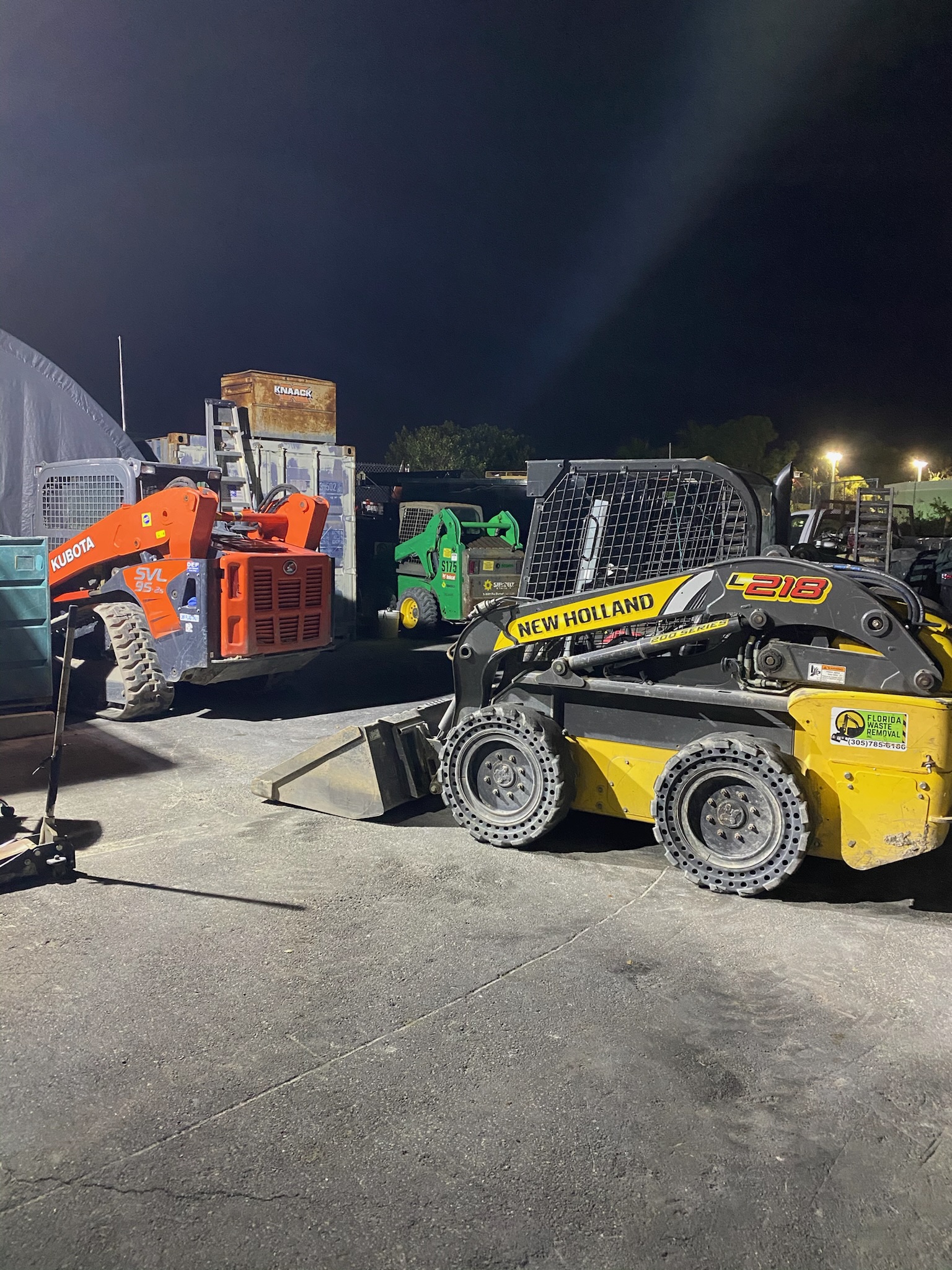 Dump truck hauling demolition debris away from a South Florida construction site