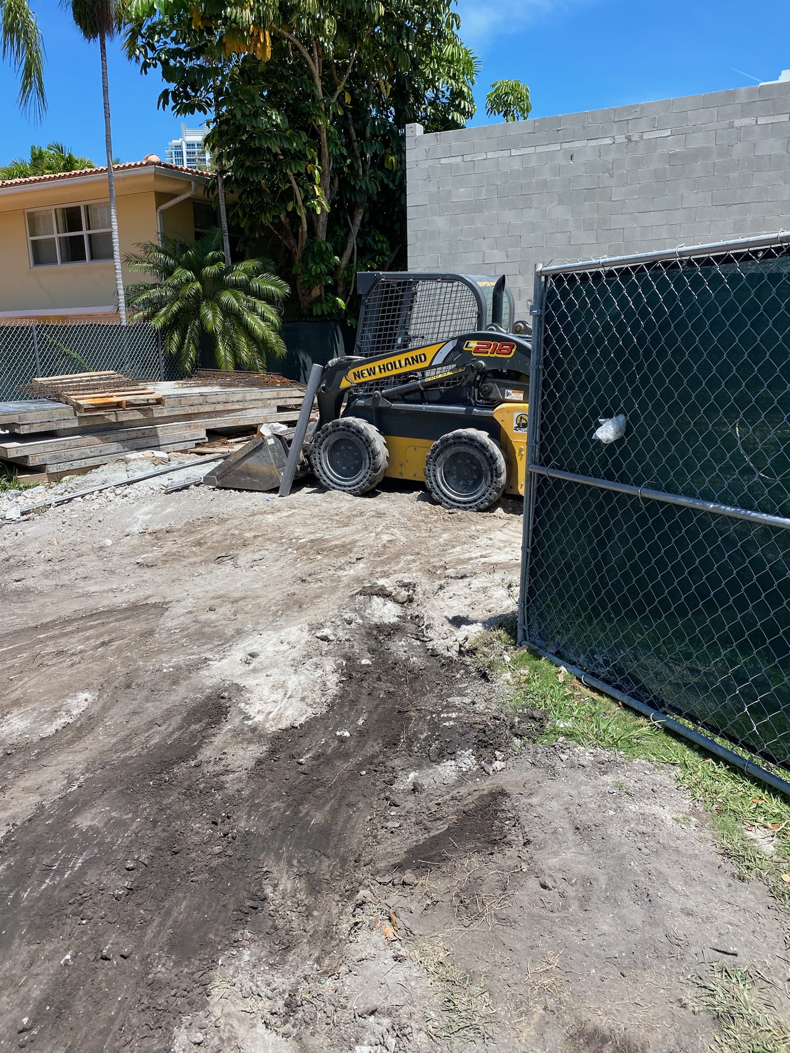 Bobcat and heavy equipment for pool digs foundation excavation and site clearing in South Florida
